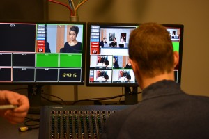 A behind the back shot of John Madden in the audio room.
